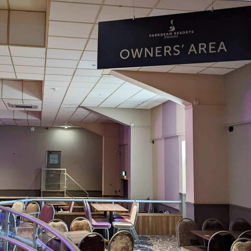A sign which reads Owners Area in a bar room.